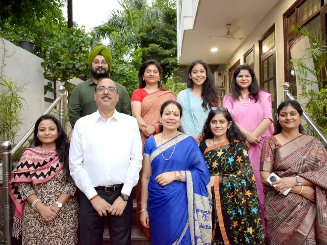 The teaching staff photographed together outside the building.