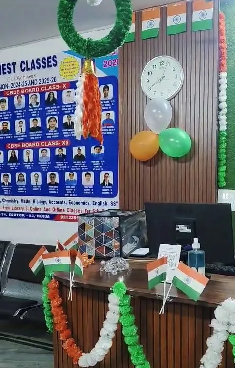 The reception desk, with the results boards, a clock and the notice board behind it.