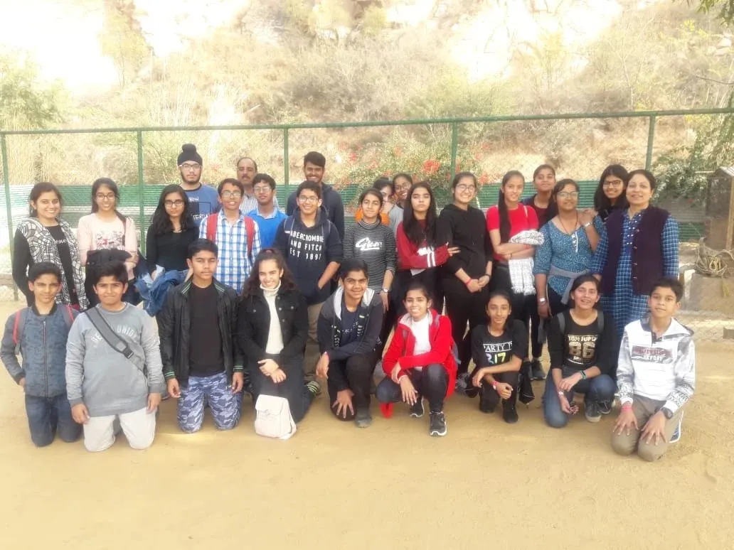 Students and teachers photographed together outdoors on a trip.